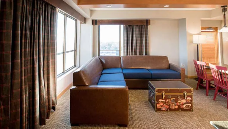 The couch and living space in the accessible Northwoods Suite
